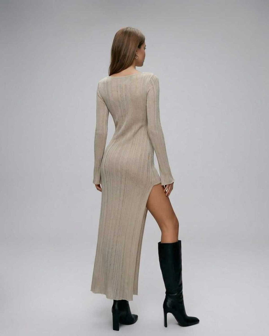 Sienna Midi Dress by Lauven, showcasing long sleeve knit design with asymmetrical split and ribbed texture.