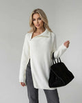 Women’s white Aspen Sweater by Lauven, featuring long sleeves and a stylish zip design.
