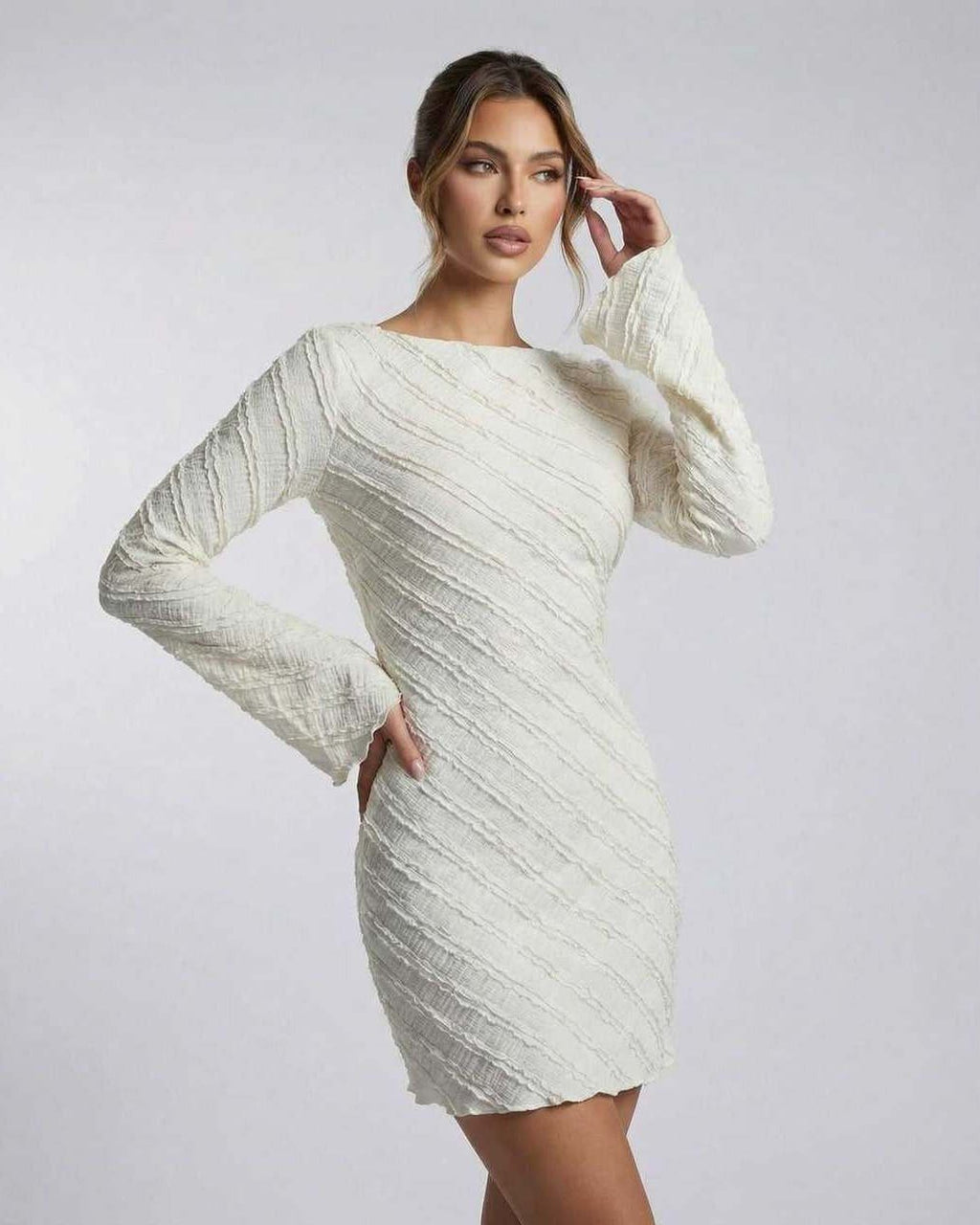 Sienna Mini Dress by Lauven, white long sleeve A-line dress with textured finish, showcasing sculpted silhouette.