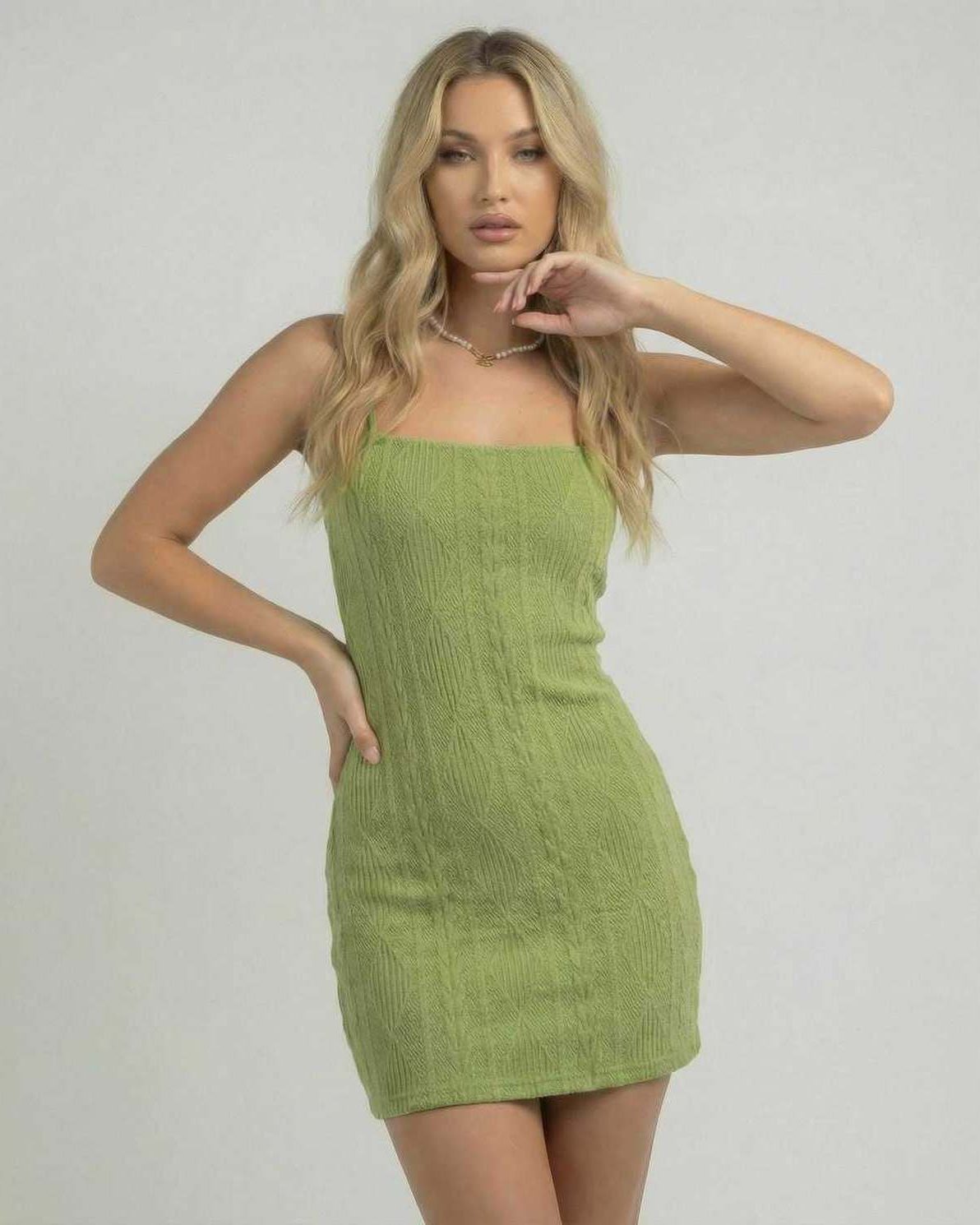 Verona Mini Dress by Lauven - Green bodycon mini dress with open back and textured finish on model.