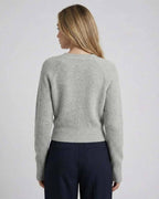 Back view of the Lauven Vienna Sweater, women’s gray ribbed knit long sleeve sweater.