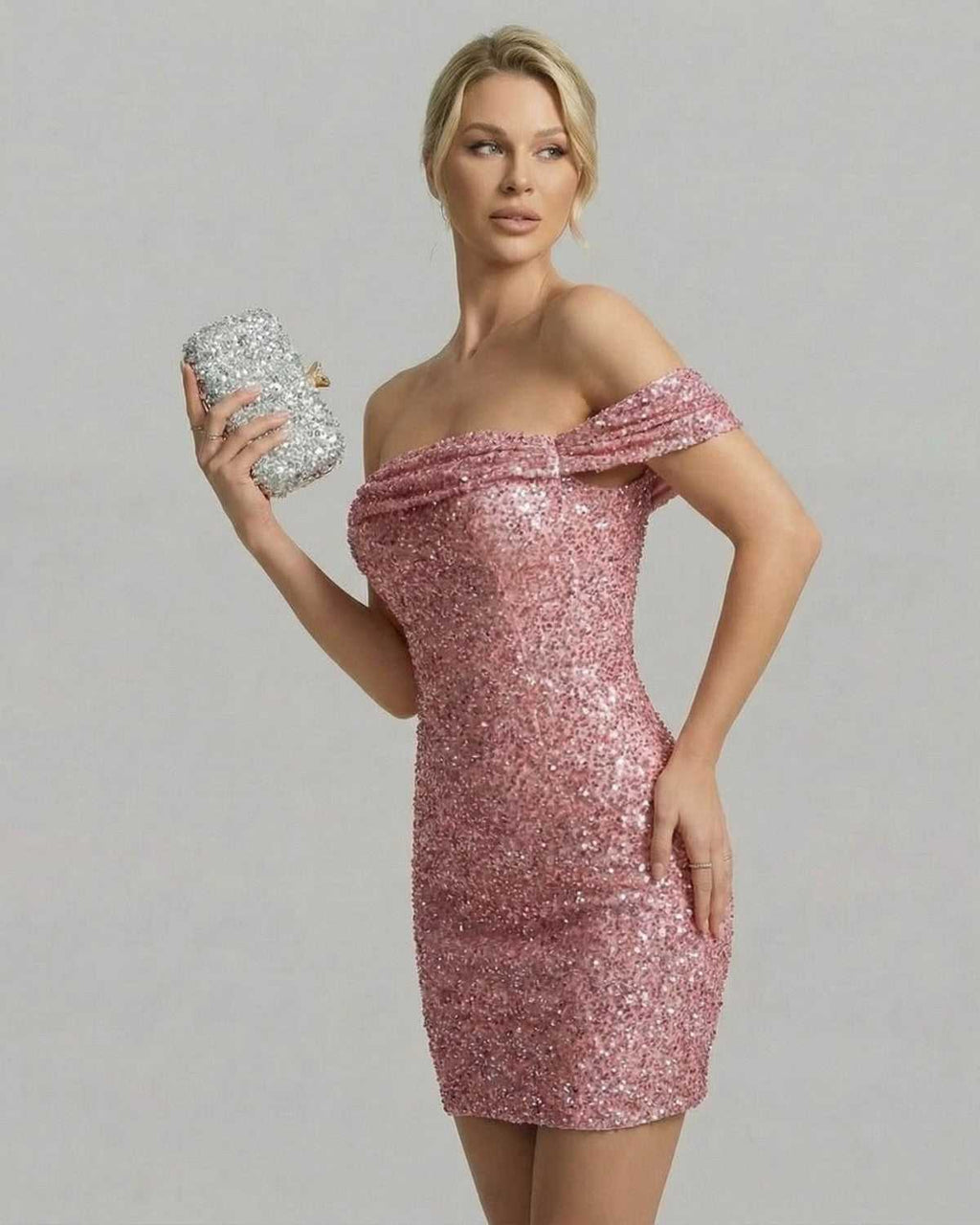 Aurora Mini Dress by Lauven in pink sequin bodycon style with asymmetrical neckline, perfect for evening events.