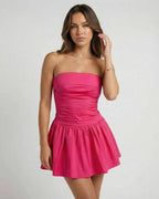 Azalea Mini Dress by Lauven – Vibrant pink strapless A-line silhouette perfect for summer events.