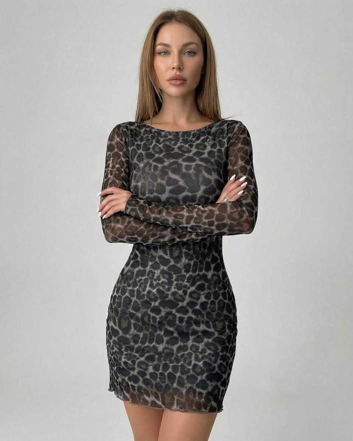 Lyra Mini Dress by Lauven featuring chic leopard print mesh design and flattering silhouette.