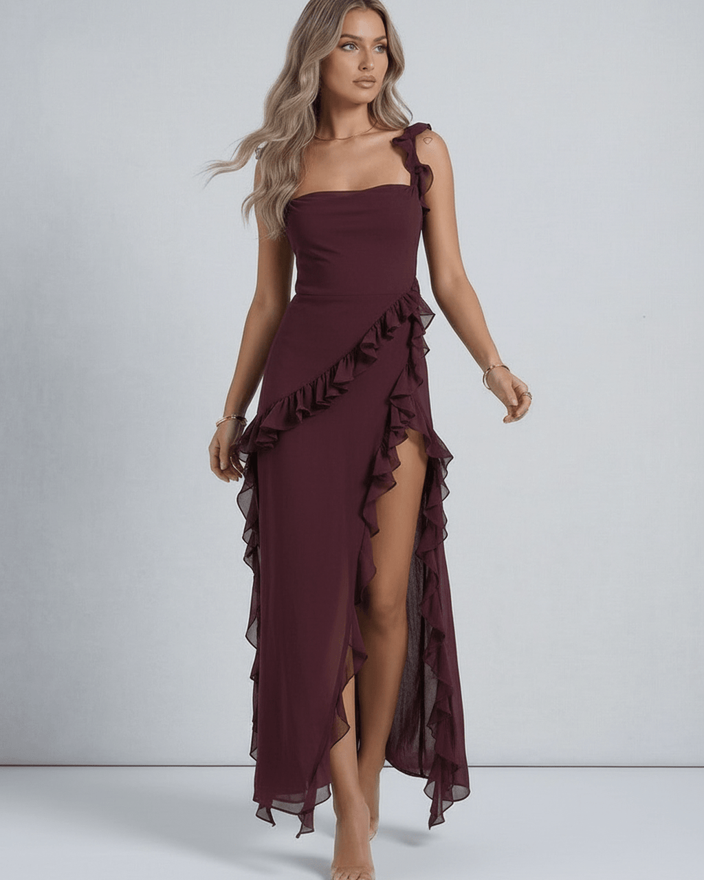 Amaranth Maxi Dress by Lauven, featuring deep plum sheer fabric, ruffled straps, and a thigh-high side slit.