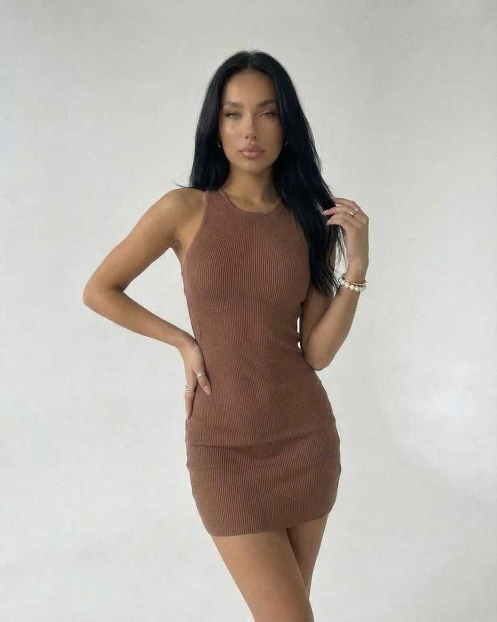 Arden Mini Dress by Lauven in brown ribbed knit, sleeveless bodycon style showcasing a smooth silhouette.