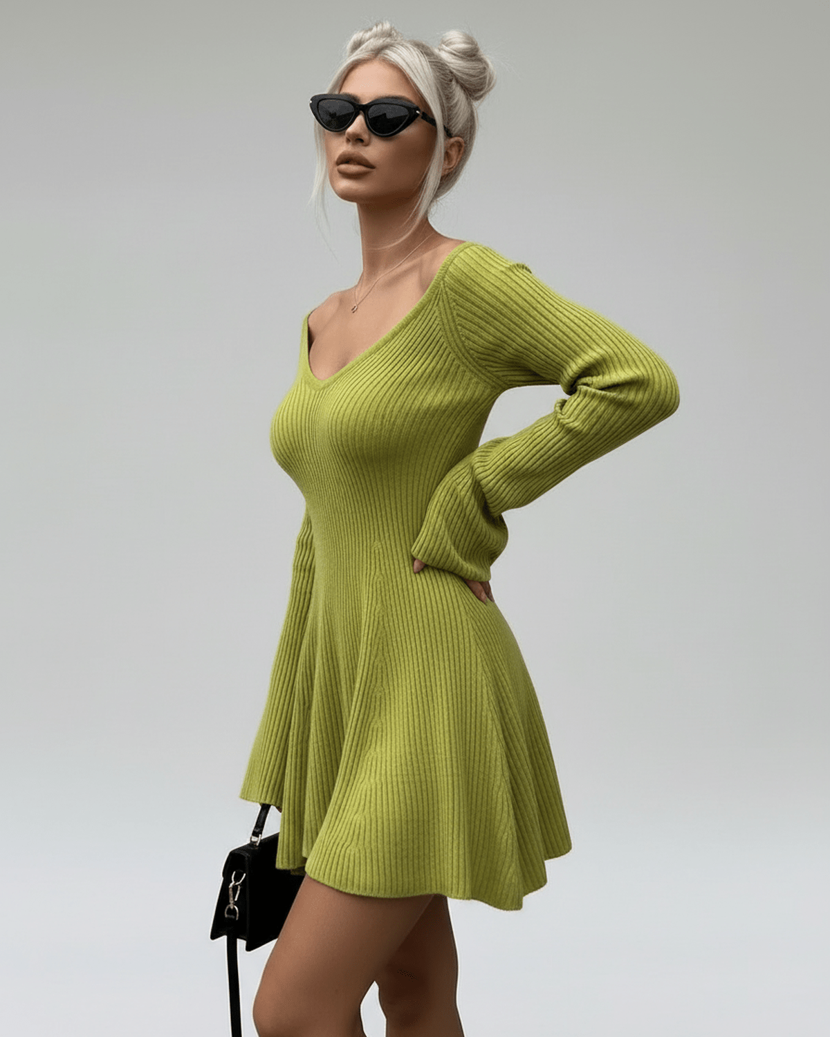 Aura Mini Dress by Lauven in slim fit green knit with V-neck and flared cuffs, perfect for modern elegance.
