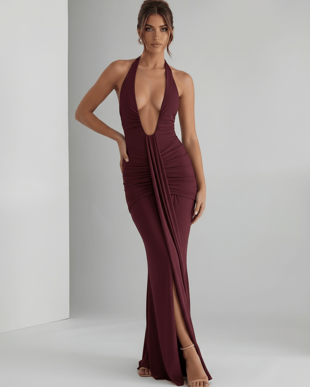 Aurelia Maxi Dress features a smooth stretch jersey fabric, halter neck, and body-skimming silhouette by Lauven.