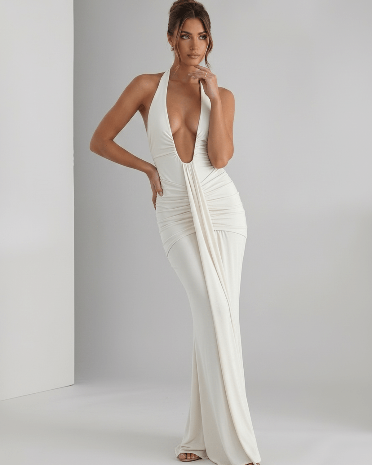 Aurelia Maxi Dress in white, featuring smooth stretch jersey, halter neck, slim fit, elegant look by Lauven.