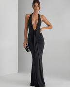 Aurelia Maxi Dress in black stretch jersey with halter neck, showcasing sleek fit and subtle ruching, by Lauven.