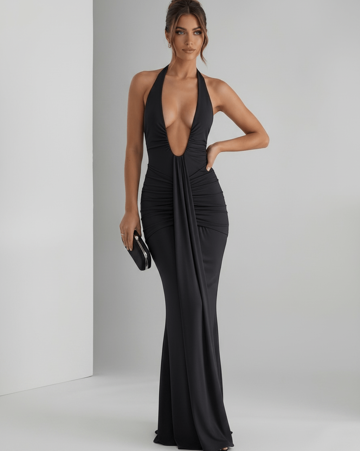 Aurelia Maxi Dress in black stretch jersey with halter neck, showcasing sleek fit and subtle ruching, by Lauven.