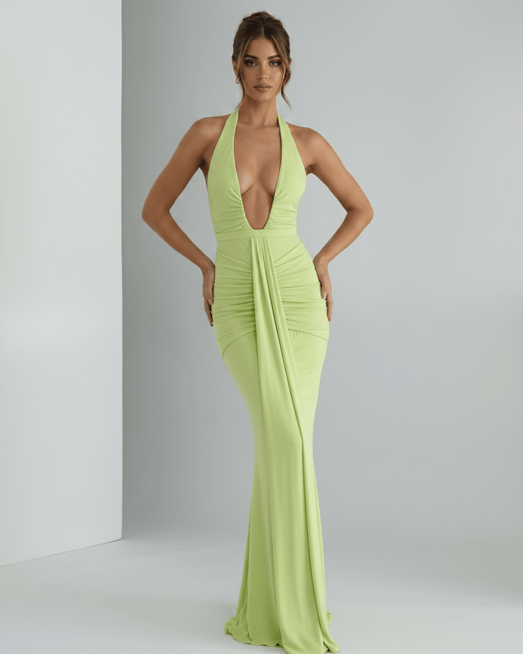 Aurelia Maxi Dress in vibrant green, featuring stretch jersey, halter neck, and subtle ruching for a modern look by Lauven.