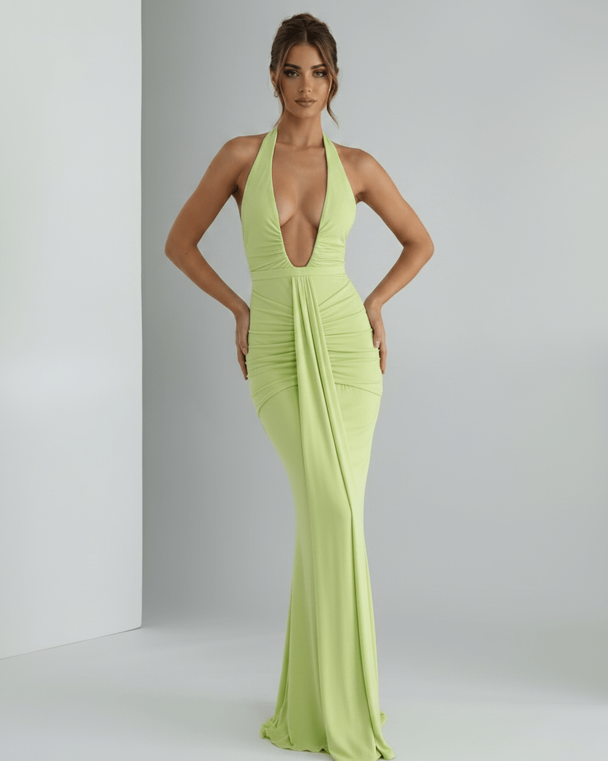 Aurelia Maxi Dress in vibrant green, featuring stretch jersey, halter neck, and subtle ruching for a modern look by Lauven.