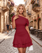 Aurelia Mini Dress in textured stretch fabric featuring asymmetrical neckline and tiered ruffle hem by Lauven.