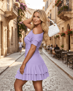 Aurelia Mini Dress featuring textured stretch fabric, asymmetrical neckline, ruched detailing, and tiered ruffle hem by Lauven.