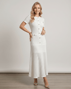 Aureline Maxi Dress in textured knit with round neck, featuring a flared hem and polished finish by Lauven.