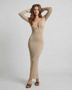 Aurora Maxi Dress by Lauven features a sleek gold sheath silhouette with a deep V-neck and metal ring accent.