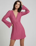 Aurora Mini Dress by Lauven in vibrant pink with flared sleeves and V-neckline, showcasing elegant pleats.