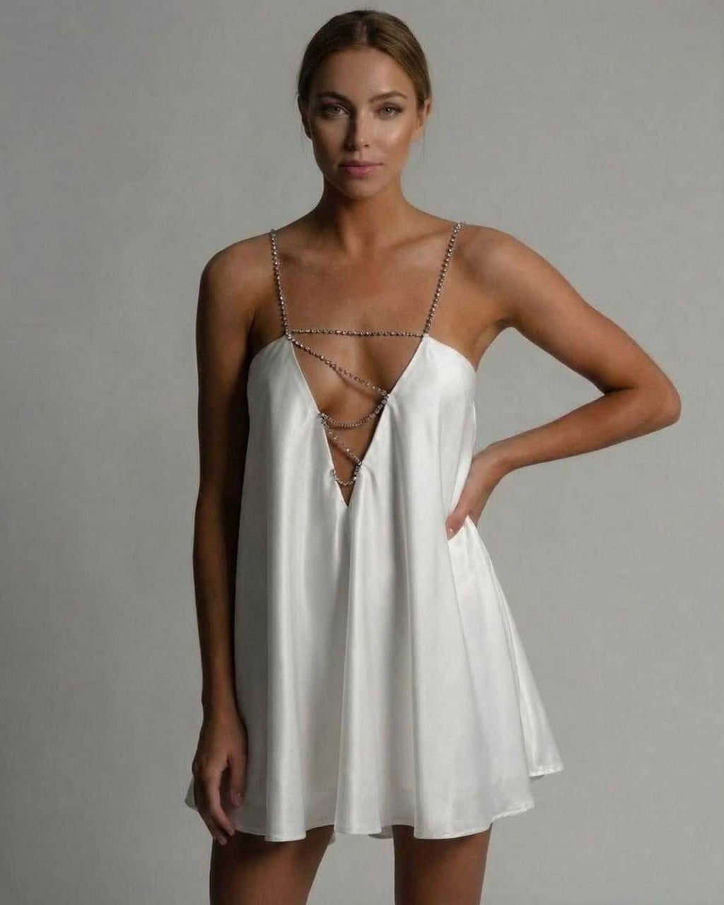 Aurora Mini Dress by Lauven in classic white satin with beaded spaghetti straps and flared skirt.