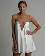 Aurora Mini Dress by Lauven, sleek satin A-line silhouette in classic white with beaded straps and a flared skirt.