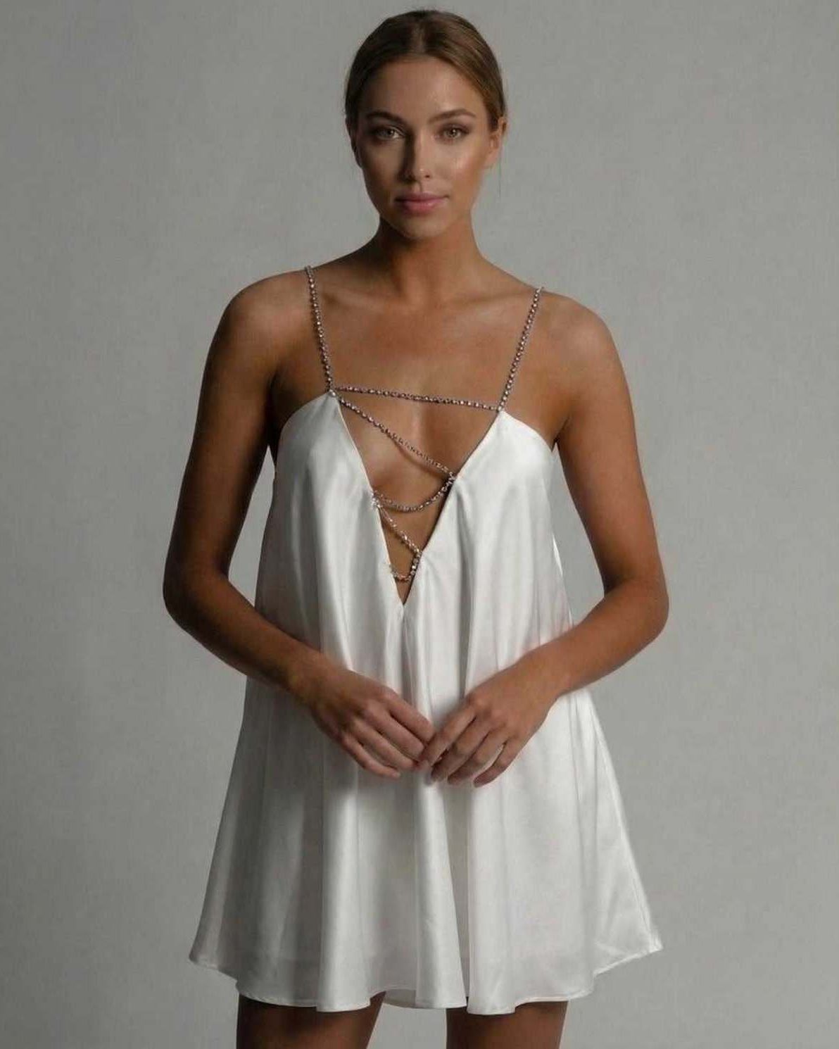 Aurora Mini Dress by Lauven featuring a satin A-line silhouette and hollow V-neckline with beaded straps.