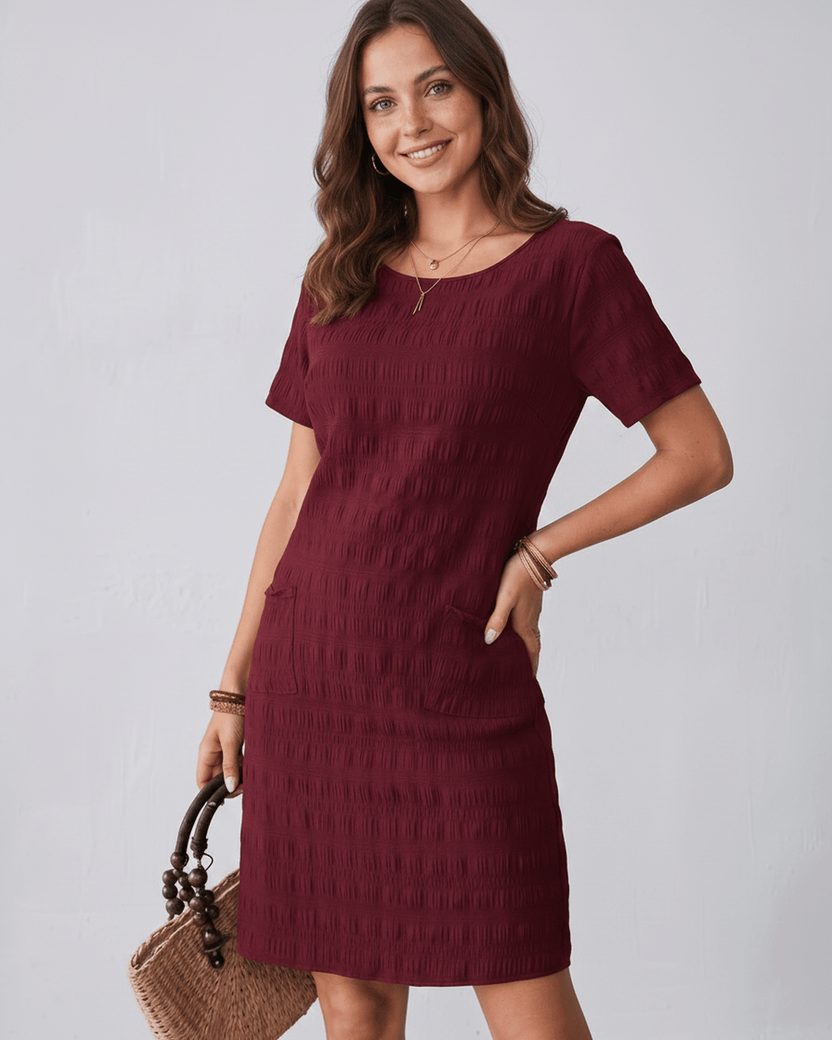 Avelin Mini Dress in textured fabric with round neckline, short sleeves, and a fresh silhouette by Lauven.