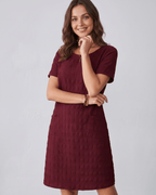 Avelin Mini Dress in burgundy, featuring textured fabric, round neckline, short sleeves, and a modern silhouette by Lauven.