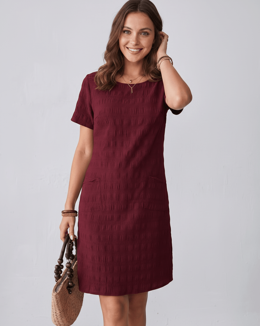Avelin Mini Dress by Lauven, textured fabric, round neckline, modern look, perfect for warm-weather styling.