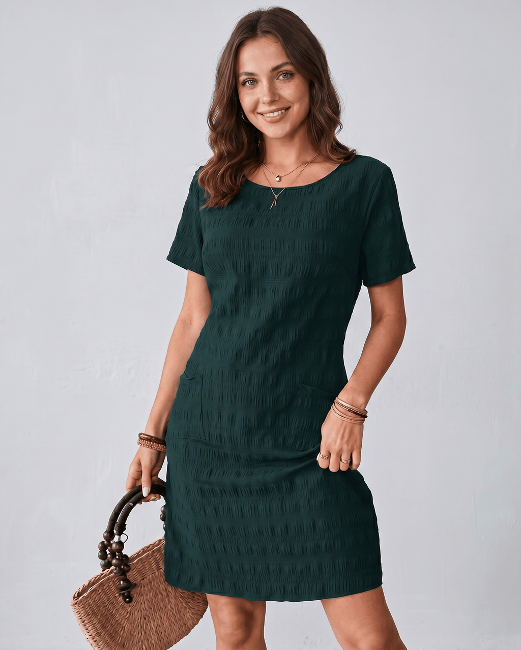 Avelin Mini Dress in textured fabric with round neckline, featuring short sleeves and a modern silhouette by Lauven.