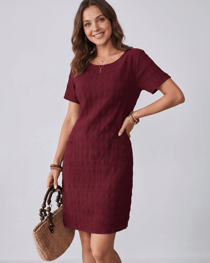 Avelin Mini Dress featuring textured fabric, round neckline, short sleeves, and a modern fit by Lauven.