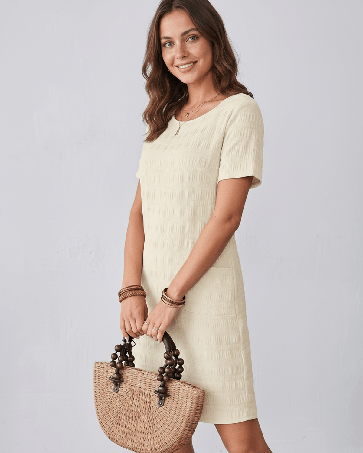 Avelin Mini Dress in textured fabric, featuring a round neckline and short sleeves, ideal for warm-weather styling by Lauven.