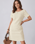 Avelin Mini Dress in textured fabric, featuring a round neckline, short sleeves, perfect for warm-weather styling by Lauven.