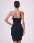 Aveline Mini Dress by Lauven, sleek ribbed knit with adjustable straps and form-fitting design, showing back view.