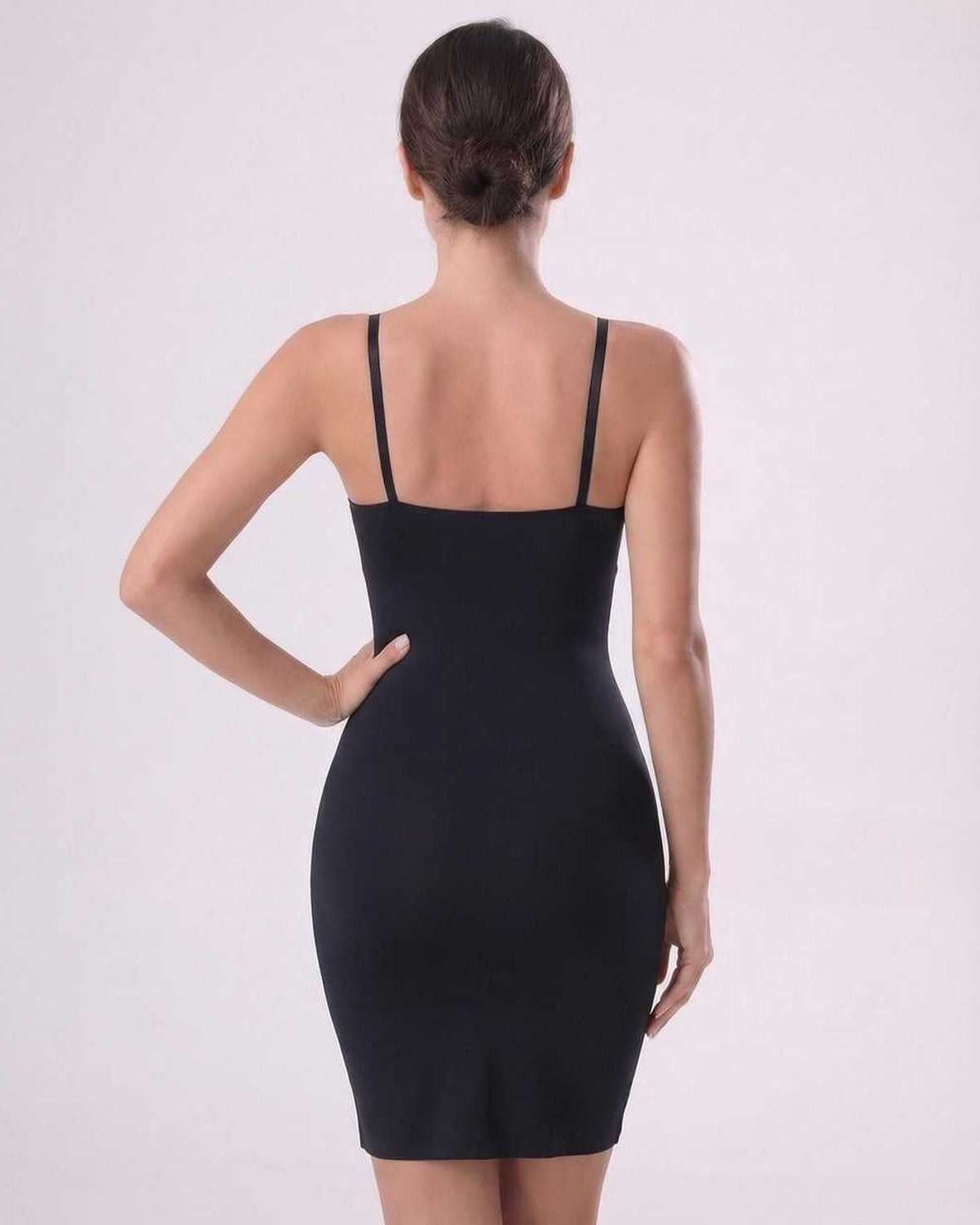 Aveline Mini Dress by Lauven, sleek ribbed knit with adjustable straps and form-fitting design, showing back view.