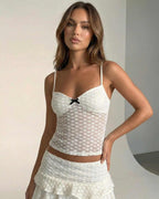 Aveline Top by Lauven - Elegant white lace camisole with bow detail and heart pattern.