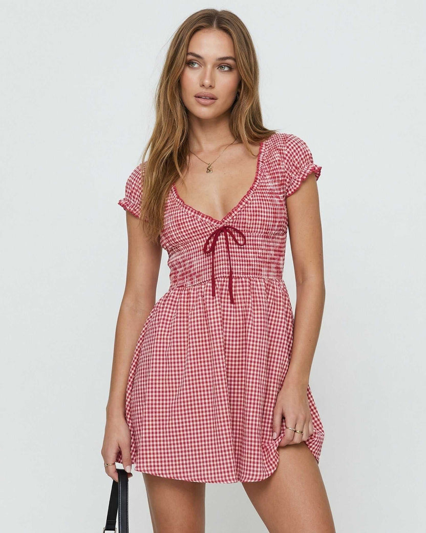 Azura Mini Dress by Lauven in red checkered pattern featuring a flattering empire waist and short sleeves.