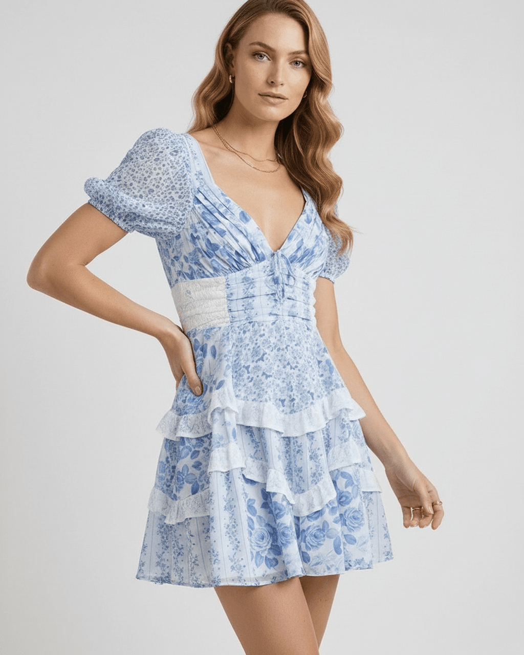 Azure Mini Dress with blue floral print, tiered ruffles, and flattering fit by Lauven.