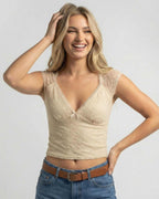 Beige Lace Top by Lauven – Women’s slim fit V-neck crop tee with delicate lace and bow detail.