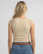 Back view of a Beige Lace Top by Lauven, showcasing the lace details and fitted style.