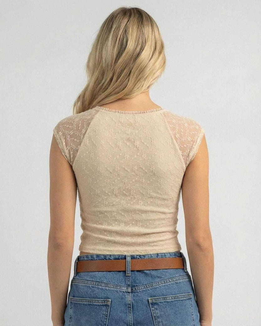 Back view of a Beige Lace Top by Lauven, showcasing the lace details and fitted style.