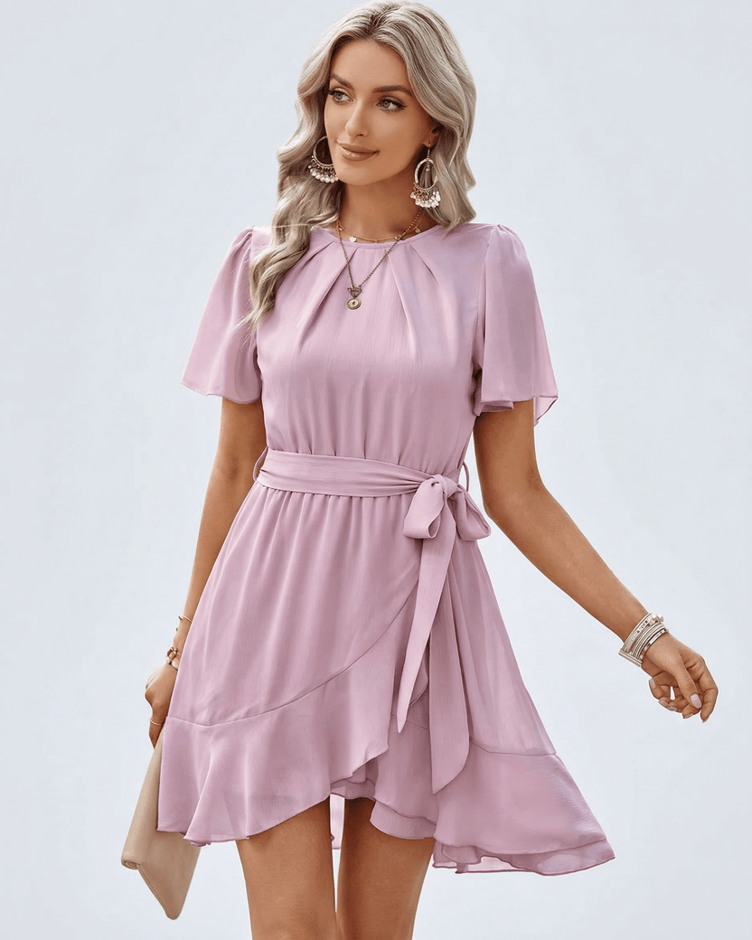 Blush Ruffle Dress by Lauven featuring flutter sleeves and a waist tie, perfect for warm weather elegance.