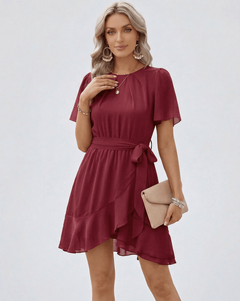 Burgundy Ruffle Dress by Lauven featuring ruffle hem, waist tie, and flutter sleeves for a sophisticated look.