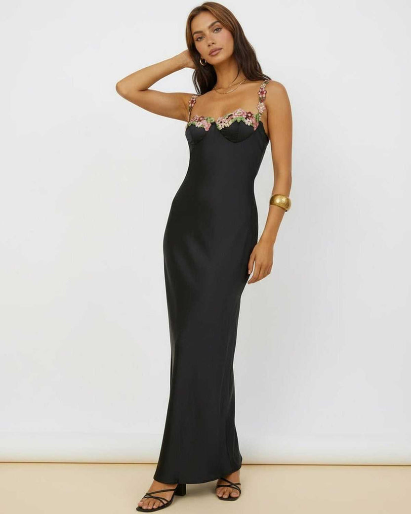 Calista Maxi Dress showcasing sleek black satin fabric and floral embroidery, exuding elegance from Lauven.