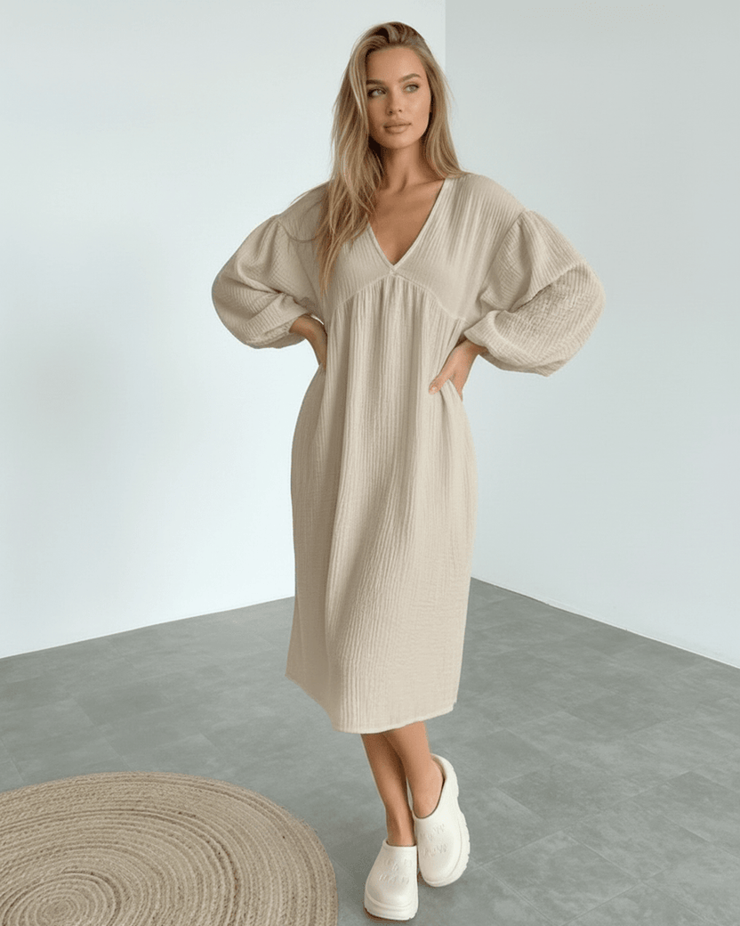 Calista Midi Dress – Beige cotton midi dress with puff sleeves, offering comfort and modern elegance from Lauven.