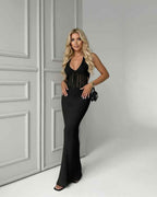 Calypso Maxi Dress, black knit, deep V-neck, ribbed texture, elegant look by Lauven, perfect for day-to-night wear.