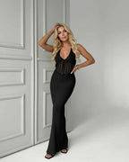 Calypso Maxi Dress - Black Knit Maxi Dress with Deep V-Neck and Ribbed Texture by Lauven, perfect for day-to-night elegance.