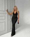Calypso Maxi Dress: Black knit dress with deep V-neck, ribbed texture, and sleeveless design by Lauven, perfect for day-to-night styling.