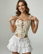 Model wearing Camellia Corset Top by Lauven, featuring floral lace-up design and structured silhouette.