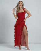 Lauven Carmine Maxi Dress in red sheer chiffon with ruffled shoulder straps and asymmetric hemline.