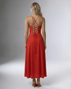 Back view of the Lauven Carmine Midi Dress with lace-up detailing and a flowing skirt, perfect for elegant occasions.